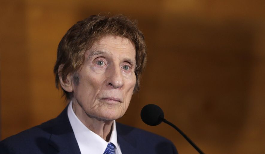 FILE- In a file photo from Nov. 14, 2014, Detroit Tigers owner Mike Ilitch listens during a news conference in Detroit. Ilitch, the owner of the Detroit Red Wings and Tigers, who founded the Little Caesars Pizza empire, has died. He was 87. Family spokesman Doug Kuiper says Ilitch died Friday, Feb. 10, 2017, at a hospital in Detroit. Ilitch and his wife opened their first Little Caesars restaurant in suburban Detroit in 1959, and the business eventually grew into the world's largest carry-out pizza chain. (AP Photo/Carlos Osorio, File)