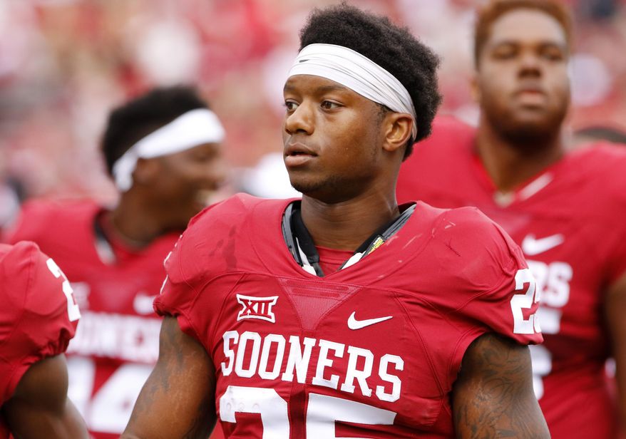 FILE - In this Sept. 19, 2015, file photo, Oklahoma running back Joe Mixon (25) before the start of an NCAA college football game against Tulsa in Norman, Okla. In a video released by the Norman Police Department, Amelia Molitor said a group of men with Mixon sexually harassed her and she rejected Mixon&#39;s advances before Mixon punched her and broke bones in her face in July 2014. (AP Photo/Alonzo Adams, File)
