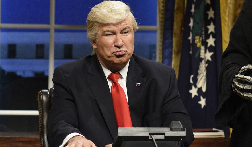 Actor Alec Baldwin appears as President Donald Trump in an opening sketch of &quot;Saturday Night Live&quot; in New York. (Will Heath/NBC via AP) ** FILE **