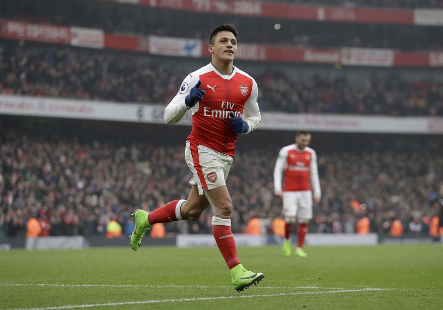 Arsenal's Alexis Sanchez celebrates scoring his side's second goal from a penalty during the English Premier League soccer match between Arsenal and Hull City at the Emirates Stadium in London, Saturday, Feb. 11, 2017. (AP Photo/Matt Dunham)