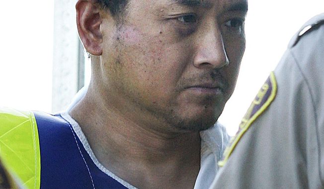 This Aug. 5, 2008, file photo shows Vince Li. Li, who was found not criminally responsible for beheading and cannibalizing a fellow passenger on a Greyhound bus has been granted his freedom. Manitoba&#x27;s Criminal Code Review Board announced Friday, Feb. 10, 2017,  it has given Will Baker, formerly known as Vince Li, an absolute discharge, meaning he is longer subject to monitoring.  (John Woods/The Canadian Press via AP, File)
