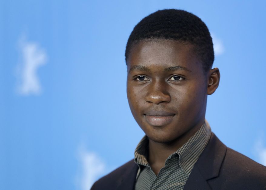 Actor Gaetan Claudia poses for the photographers during a photo call for the film 'Felicite' at the 2017 Berlinale Film Festival in Berlin, Germany, Saturday, Feb. 11, 2017. (AP Photo/Michael Sohn)