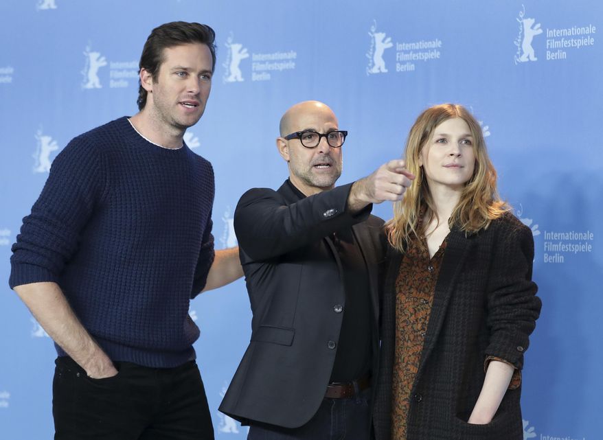 From left, actor Armie Hammer, director Stanley Tucci and actress Clemence Poesy pose for the photographers during a photo call for the film 'Final Portrait' at the 2017 Berlinale Film Festival in Berlin, Germany, Saturday, Feb. 11, 2017. (AP Photo/Michael Sohn)