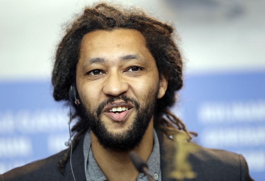 Director Alain Gomis speaks during a press conference for the film 'Felicite' at the 2017 Berlinale Film Festival in Berlin, Germany, Saturday, Feb. 11, 2017. (AP Photo/Michael Sohn)