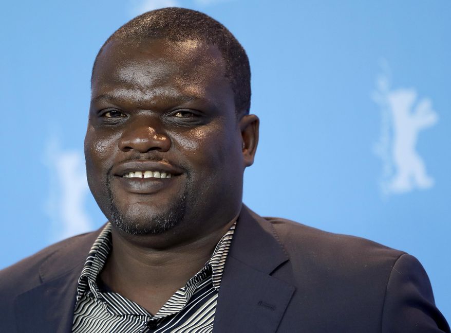 Actor Papi Mpaka poses for the photographers during a photo call for the film 'Felicite' at the 2017 Berlinale Film Festival in Berlin, Germany, Saturday, Feb. 11, 2017. (AP Photo/Michael Sohn)