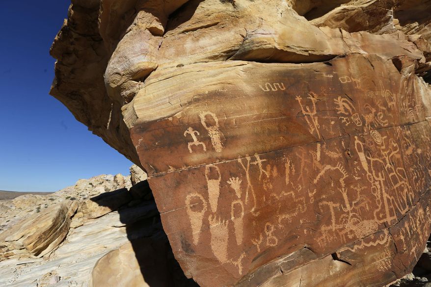 This Jan. 17, 2017 photo, shows petroglyphs at Gold Butte National Monument in Gold Butte, Nev. At Nevada's newest national monument, you can hike through twisted sandstone sculptures, tour outdoor galleries of ancient rock art, explore a historic ghost town and stare down the Devil's Throat. (Christian K. Lee/Las Vegas Review-Journal via AP)