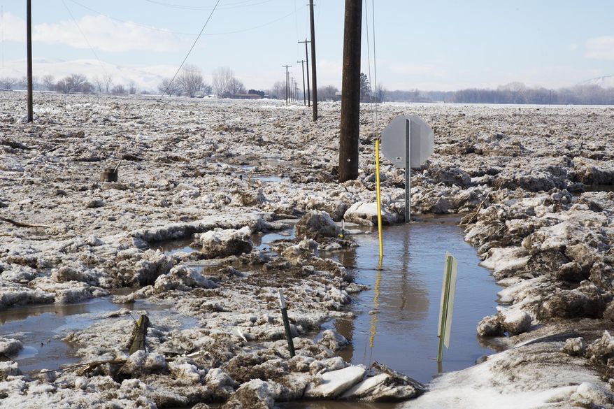 The Weiser River in Weiser, Idaho, overflowed early Friday, Feb. 10, 2017, flooding areas south of the river near Cove and Couper roads with ice and water.(Darin Oswald /Idaho Statesman via AP)