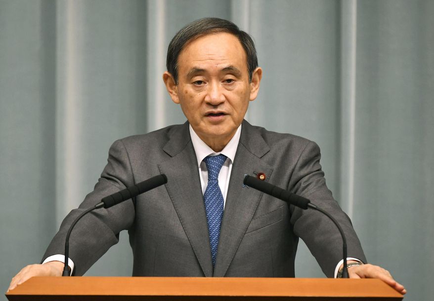 Japan's Chief Cabinet Secretary Yoshihide Suga speaks on a missile launch by North Korea at the prime minister's official residence in Tokyo Sunday, Feb. 12, 2017. North Korea reportedly fired a ballistic missile early Sunday in what would be its first such test of the year and an implicit challenge to President Donald Trump's new administration. The missile is believed to have splashed down into the sea between the Korean Peninsula and Japan. Suga told reporters the missile did not hit Japanese territorial seas. (Muneyoshi Someya/Kyodo News via AP)