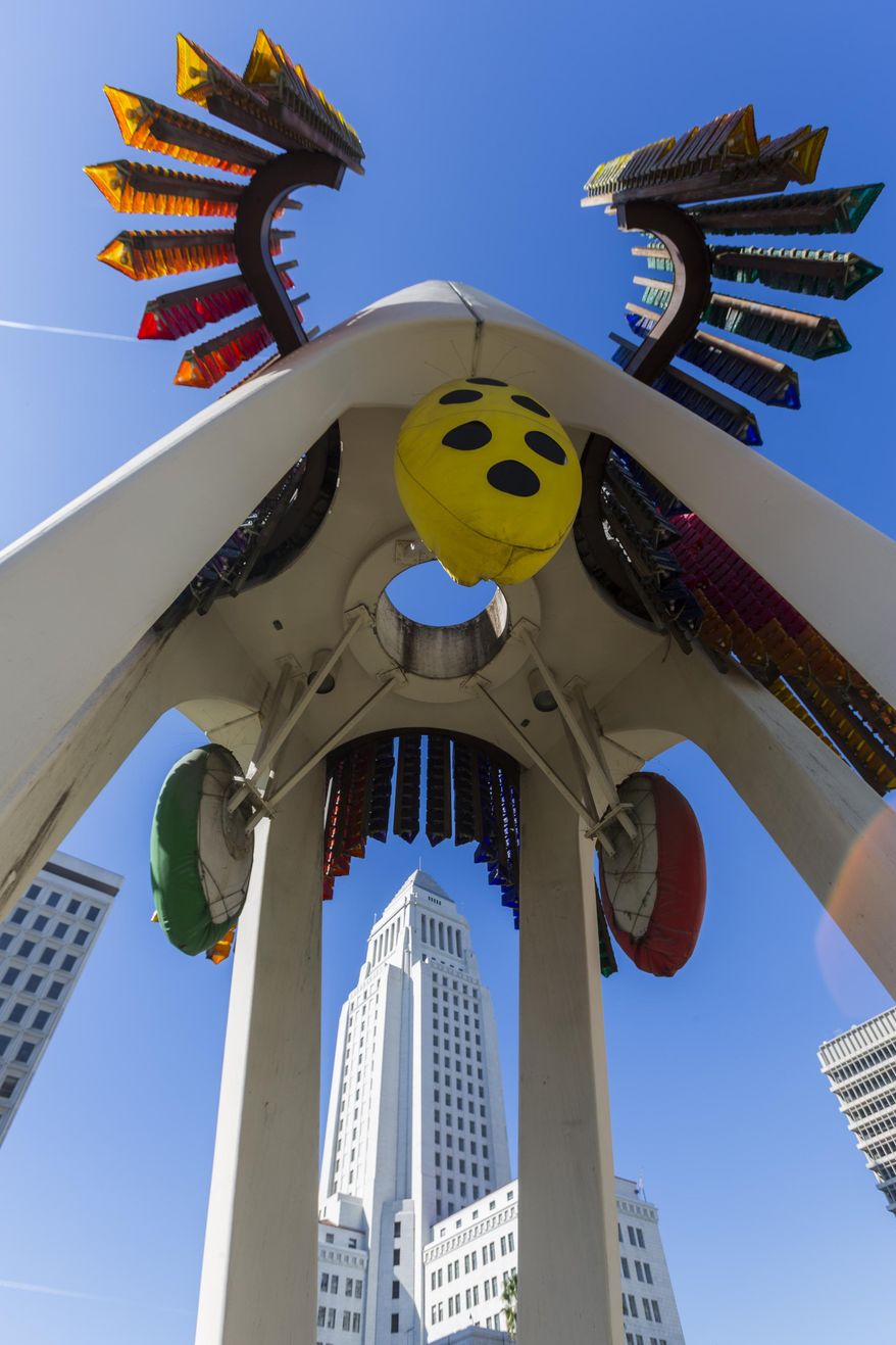 This Wednesday, Feb. 1, 2017 photo shows Joseph L. Young's Triforium a "polyphonoptic" public sculpture at the Fletcher Bowron Square downtown Los Angeles. For 40 years Joseph Young festooned public buildings, open spaces and private places across his adopted city of Los Angeles with dozens of brilliant, larger-than-life artworks. Mocked for 42 years as pointless and silly looking, the six-story, space-age-like structure may finally get a second chance, thanks to a $100,000 innovation grant. (AP Photo/Damian Dovarganes)