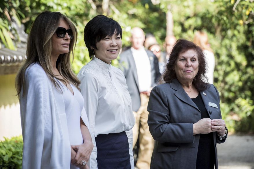 First lady Melania Trump, left, and Akie Abe, wife of Japanese Prime Minister Shinzo Abe, center, tour Morikami Museum and Japanese Gardens with park administrator Bonnie White Lemay in Delray Beach, Fla., on Saturday, Feb. 11, 2017. (Michael Ares/Palm Beach Post via AP)