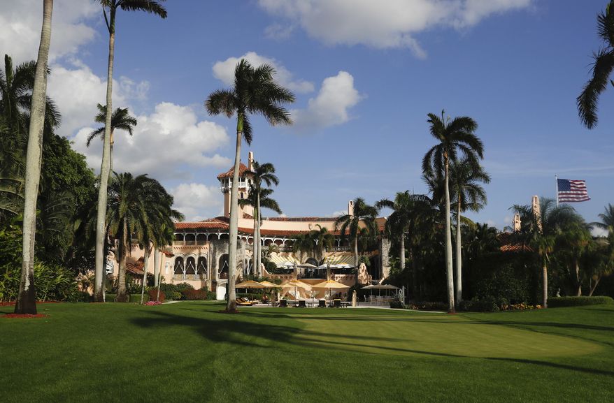 FILE - In this Nov. 27, 2016 file photo, Mar-a-Lago is seen from the media van window in Palm Beach, Fla. Trump has described the sprawling Mar-a-Lago property as the Winter White House and has spent two weekends there this month.   (AP Photo/Carolyn Kaster, File)