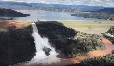 This Friday, Feb. 10, 2017 image from video provided by the office of Assemblyman Brian Dahle shows water flowing over an emergency spillway of the Oroville Dam in Oroville, Calif., during a helicopter tour by the Butte County Sheriff&#39;s office. About 150 miles northeast of San Francisco, Lake Oroville is one of California’s largest man-made lakes, and the 770-foot-tall Oroville Dam is the nation&#39;s tallest. (Josh F.W. Cook/Office of Assemblyman Brian Dahle via AP)