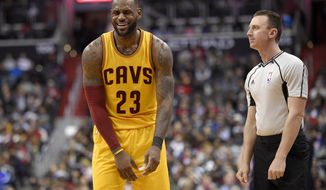Cleveland Cavaliers forward LeBron James (23) reacts to an official during the second half of an NBA basketball game against the Washington Wizards, Monday, Feb. 6, 2017, in Washington. The Cavaliers won 140-135 in overtime. (AP Photo/Nick Wass)