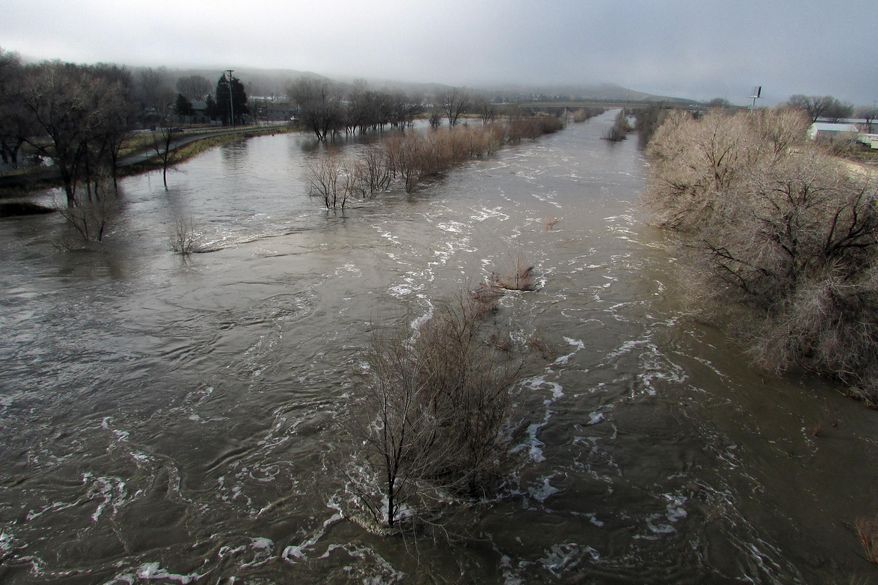 The Humboldt River is swollen far beyond its normally narrow channel through Elko, Nev., on Saturday morning, Feb. 11, 2017. (Jeff Mullins/The Daily Free Press via AP)