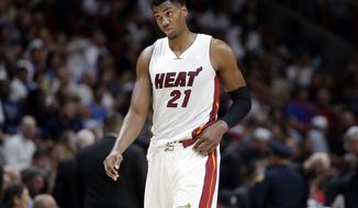 Miami Heat&#39;s Hassan Whiteside (21) walks on the court during the second half of an NBA basketball game against the Orlando Magic, Monday, Feb. 13, 2017, in Miami. The Magic defeated the Heat 116-107. (AP Photo/Lynne Sladky)