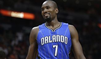 Orlando Magic&#39;s Serge Ibaka (7) smiles after being called for a foul against Miami Heat&#39;s Goran Dragic (7) during the second half of an NBA basketball game, Monday, Feb. 13, 2017, in Miami. The Magic defeated the Heat 116-107. (AP Photo/Lynne Sladky)