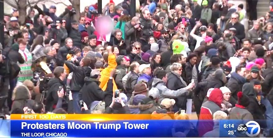 Hundreds of protesters showed up on Feb. 12, 2017, along the Chicago River to drop their pants while facing the Trump International Hotel & Tower. (ABC-7 Chicago screenshot)