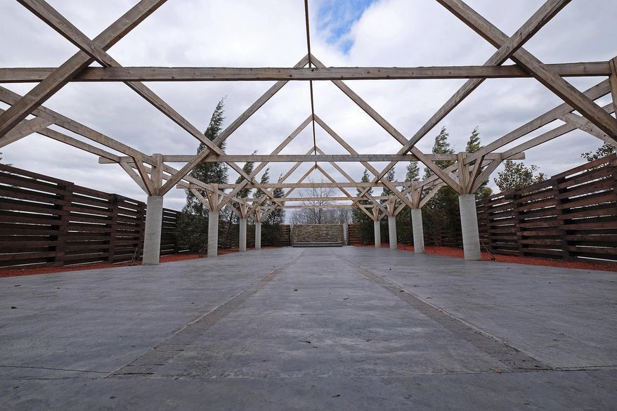 In this Jan. 27, 2017 photo, the recent courtyard addition to the venues at the Garden Grove Event Center is seen in Carbondale, Ill. Fitness and weddings might seem like an unlikely pairing. But for Garden Grove Event Center, the two work together beautifully. The multi-purpose facility, formerly named Sports Blast, is the home of Warehouse: The Ultimate Gym, along with three indoor reception venues and three outdoor ceremony spaces. (Byron Hetzler/The Southern, via AP)