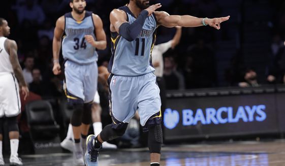 Memphis Grizzlies&#39; Mike Conley (11) reacts after making a three point basket as during the second half of an NBA basketball game against the Brooklyn Nets Monday, Feb. 13, 2017, in New York. The Grizzlies won 112-103. (AP Photo/Frank Franklin II)