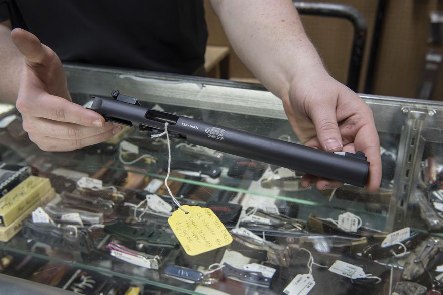 In this file photo taken Jan. 31, 2017, a silencer is displayed at Ed's Public Safety gun shop in Stockbridge, Ga. (AP Photo/Lisa Marie Pane) ** FILE **