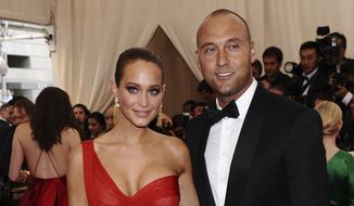 In this May 4, 2015, file photo, Derek Jeter, right, and Hannah Davis arrive at The Metropolitan Museum of Art&#39;s Costume Institute benefit gala celebrating &amp;quot;China: Through the Looking Glass&amp;quot; in New York. Hannah Jeter announced on Monday, Feb. 13, 2017, that the couple is expecting their first child together. (Photo by Charles Sykes/Invision/AP, File)
