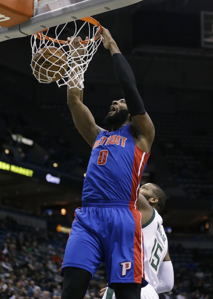 Detroit Pistons' Andre Drummond (0) dunks in front of the Milwaukee Bucks' Greg Monroe during the first half of an NBA basketball game Monday, Feb. 13, 2017, in Milwaukee. (AP Photo/Jeffrey Phelps)