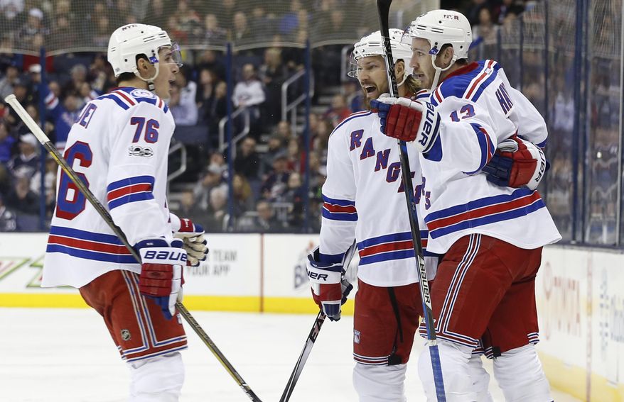 New York Rangers&#39; Kevin Hayes, right, celebrates his goal against the Columbus Blue Jackets with teammates Brady Skjei, left, and Kevin Klein during the third period of an NHL hockey game Monday, Feb. 13, 2017, in Columbus, Ohio. The Rangers beat the Blue Jackets 3-2. (AP Photo/Jay LaPrete)