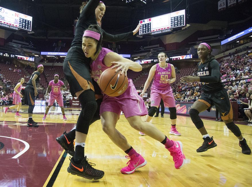 Florida State guard Brittany Brown runs up against the Texas forward Audrey-Ann Caron-Goudreau in the second half of an NCAA college basketball game in Tallahassee, Fla., Monday, Feb. 13, 2017. Texas defeated Florida State 88-92 in double overtime. (AP Photo/Mark Wallheiser)