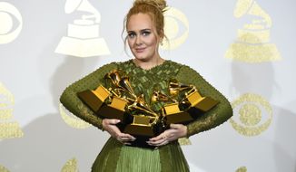 Adele poses in the press room with the awards for album of the year for &amp;quot;25&amp;quot;, song of the year for &amp;quot;Hello&amp;quot;, record of the year for &amp;quot;Hello&amp;quot;, best pop solo performance for &amp;quot;Hello&amp;quot;, and best pop vocal album for &amp;quot;25&amp;quot; at the 59th annual Grammy Awards at the Staples Center on Sunday, Feb. 12, 2017, in Los Angeles. (Photo by Chris Pizzello/Invision/AP)