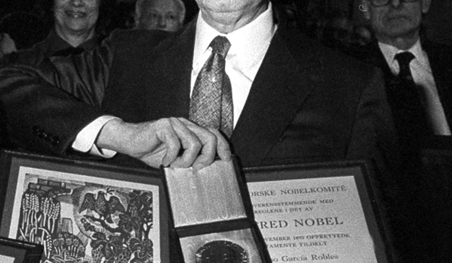 FILE - In this Dec. 10, 1982 file photo, co-winner of the 1982 Nobel Peace Prize, Alfonso Garcia Robles, of Mexico, poses with his Nobel prize diploma and medal in Oslo, Norway, awarded for his work on behalf of nuclear disarmament. The Nobel Peace Prize medal awarded to the Mexican diplomat and nuclear disarmament expert will be auctioned in April 2017. Christie's in New York made the announcement on Tuesday, Feb. 14, the 50th anniversary of the signing of a treaty that created a nuclear-free zone in Latin America and the Caribbean. (AP Photo/Jens O. Kvale, File)