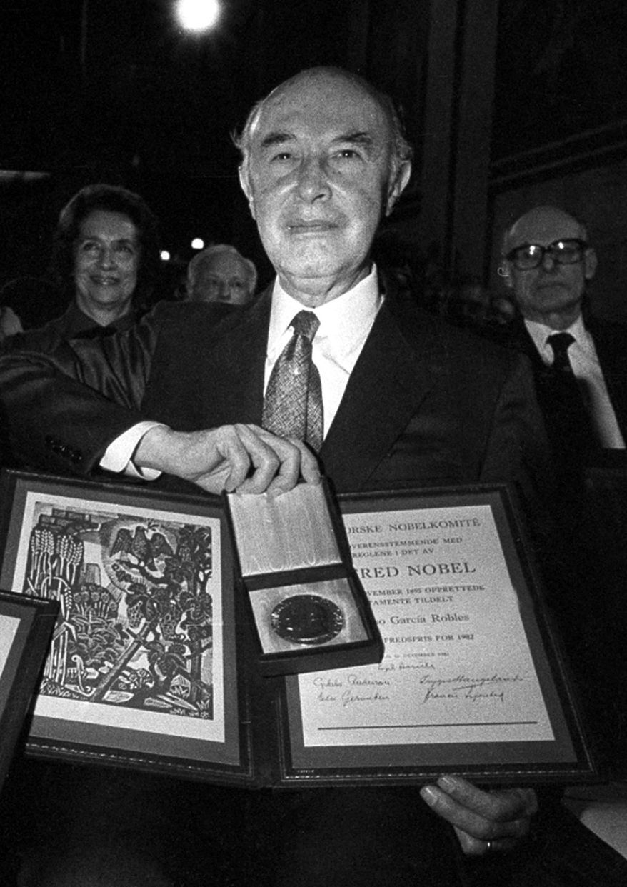 FILE - In this Dec. 10, 1982 file photo, co-winner of the 1982 Nobel Peace Prize, Alfonso Garcia Robles, of Mexico, poses with his Nobel prize diploma and medal in Oslo, Norway, awarded for his work on behalf of nuclear disarmament. The Nobel Peace Prize medal awarded to the Mexican diplomat and nuclear disarmament expert will be auctioned in April 2017. Christie's in New York made the announcement on Tuesday, Feb. 14, the 50th anniversary of the signing of a treaty that created a nuclear-free zone in Latin America and the Caribbean. (AP Photo/Jens O. Kvale, File)