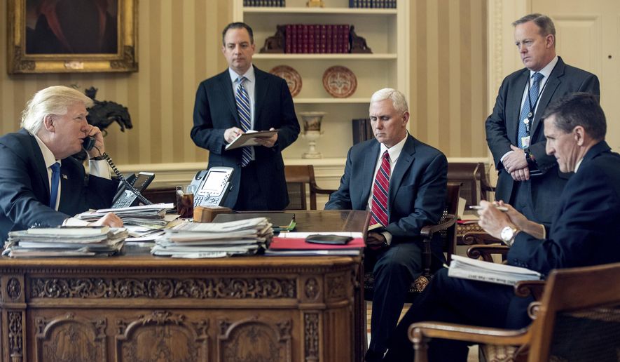 FILE - In this Jan. 28, 2017, file photo, President Donald Trump accompanied by, from second from left, Chief of Staff Reince Priebus, Vice President Mike Pence, White House press secretary Sean Spicer and National Security Adviser Michael Flynn speaks on the phone with Russian President Vladimir Putin in the Oval Office at the White House in Washington. Flynn resigned as President Donald Trump&#x27;s national security adviser Monday, Feb. 13, 2017. (AP Photo/Andrew Harnik, File)