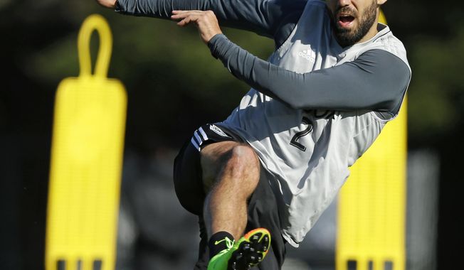 Seattle Sounders forward Clint Dempsey kicks the ball Monday, Feb. 13, 2017, during training in Tukwila, Wash. Dempsey says the symptoms that eventually led him to being diagnosed with an irregular heartbeat first surfaced last February but it wasn't until late summer that it became serious enough to affect his ability to play. Dempsey spoke to the media Tuesday, Fe.b 14, 2017 for the first time since he was diagnosed with the irregular heartbeat in August and his season was shut down. (AP Photo/Ted S. Warren)