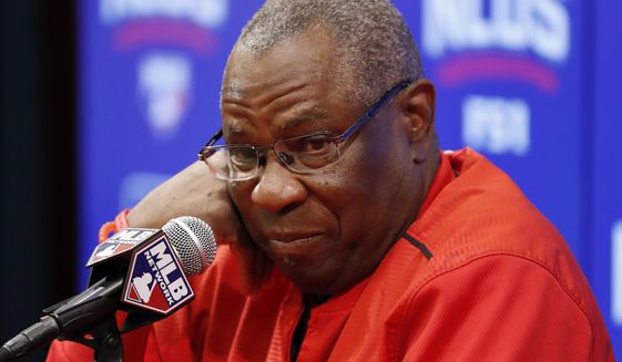 FILE - In this Oct. 13, 2016 file photo, Washington Nationals manager Dusty Baker listens to a question during a media availability before Game 5 of baseball&#39;s National League Division Series against the Los Angeles Dodgers, at Nationals Park in Washington. Baker began preparations for his second spring training as the Nationals&#39; manager Tuesday, Feb. 14, 2017, when players began reporting to camp in West Palm Beach, Fla. (AP Photo/Alex Brandon, File)