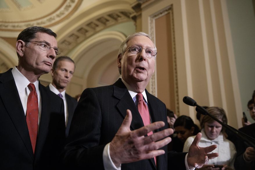 Senate Majority Leader Mitch McConnell of Ky., center, joined from left by Sen. John Barrasso, R-Wyo., and Sen. John Thune, R-S.D., takes questions from reporters about President Donald Trump's ousted national security adviser, Michael Flynn, Tuesday, Feb. 14, 2017, on Capitol Hill in Washington. (AP Photo/J. Scott Applewhite)