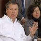 FILE – In this Nov. 3, 2010, file photo, Ohio Gov.-elect John Kasich, left, answers questions as his newly appointed chief of staff Beth Hansen, right, listens during a news conference in Columbus, Ohio. Kasich, Hansen, the Republican governor&#x27;s spokesman Jim Lynch and the governor&#x27;s security detail depart for Germany and England on Thursday, Feb. 16, 2017, for business and policy discussions with corporate and world leaders planned by the governor&#x27;s privatized job-creation office JobsOhio. (AP Photo/Jay LaPrete, File)