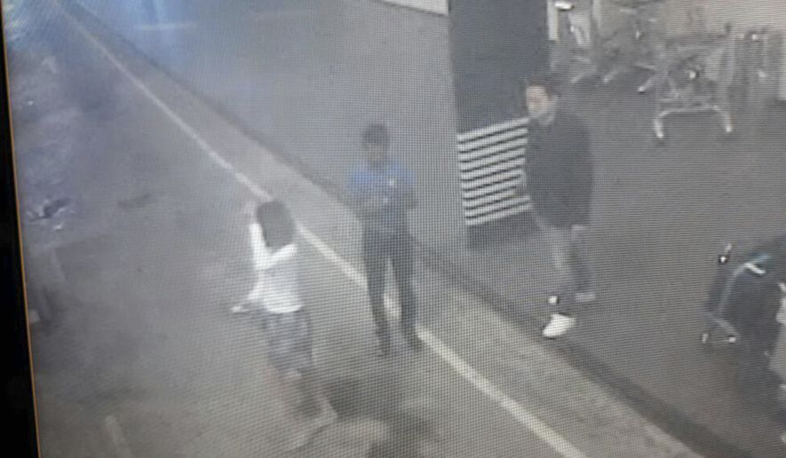 This image provided by Star TV on Wednesday, Feb. 15, 2017, of closed circuit television footage from Monday, Feb 13, 2017, shows a woman, left, at Kuala Lumpur International Airport in Sepang, Malaysia, who police say was arrested Wednesday in connection with the death of Kim Jong-nam, the half brother of North Korean leader Kim Jong-un. (Star TV via AP)