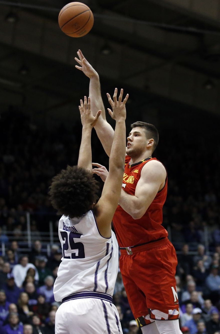 Maryland center Michal Cekovsky, right, shoots over Northwestern center Barret Benson during the first half of an NCAA college basketball game Wednesday, Feb. 15, 2017, in Evanston, Ill. (AP Photo/Nam Y. Huh)