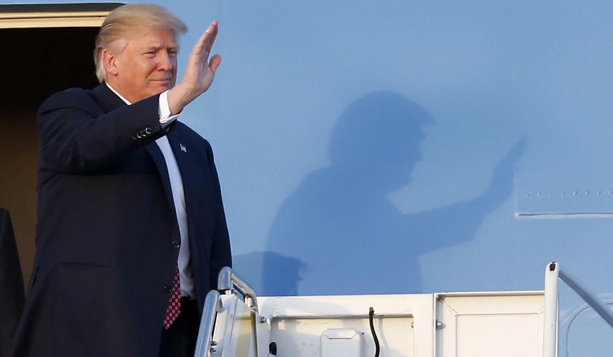 President Donald Trump waves to supporters on the steps of Air Force One as he arrives in West Palm Beach, Fla., Friday, Feb. 10, 2017. (AP Photo/Wilfredo Lee)
