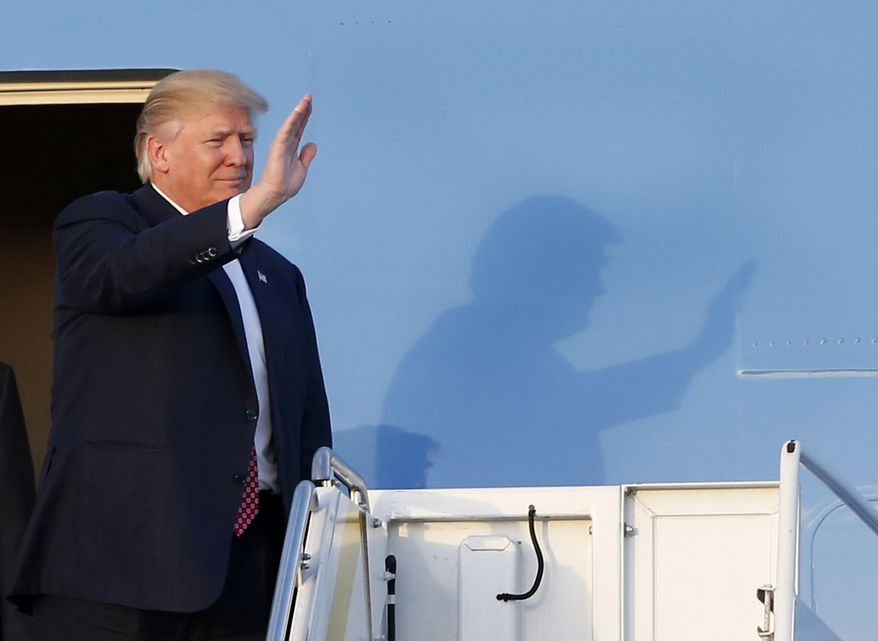 President Donald Trump waves to supporters on the steps of Air Force One as he arrives in West Palm Beach, Fla., Friday, Feb. 10, 2017. (AP Photo/Wilfredo Lee)