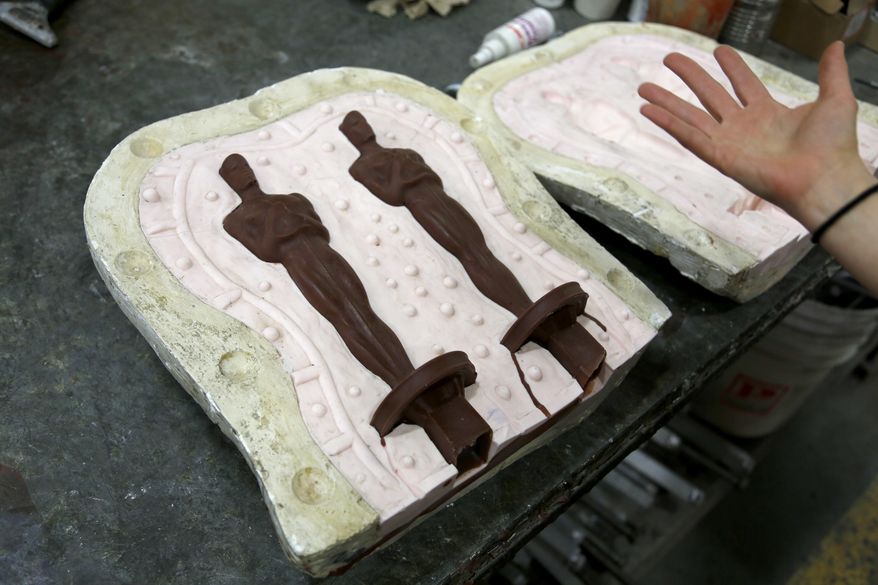 Wax versions of the Oscar statuette are just one step in the process of making the completed version at the Polich Tallix Fine Art Foundry in Rock Tavern, N.Y., Thursday, Jan. 12, 2017. Every Oscar fist-pumped or tearfully cradled by Academy Award winners is first cast, buffed and fussed over by people far from Hollywood who have spent the last several months making 60 identical gold Oscars for the Feb. 26th awards. (AP Photo/Seth Wenig)
