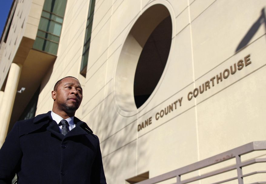 In this Monday, Feb. 13, 2017, photo, Jarrett Adams stands outside the Dane County Courthouse in Madison, Wis. Adam, who spent seven years in prison for a Wisconsin rape before he was cleared, is now an attorney with the Innocence Project in New York and is trying to clear another man of the same crime. Adams made his first appearance in a Dane County courtroom as an attorney during a hearing in that sexual assault case Tuesday, Feb. 14. (AP Photo/Carrie Antlfinger)