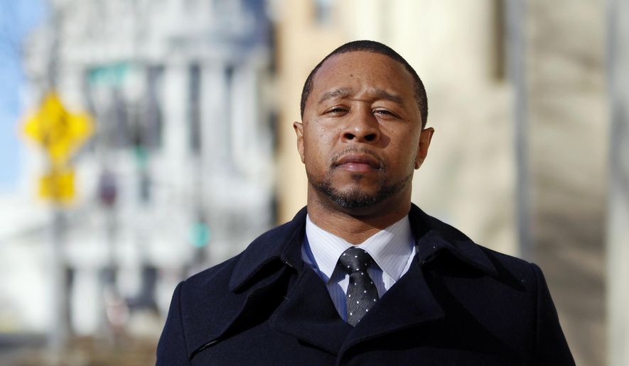 In this Monday, Feb. 13, 2017, photo, Jarrett Adams stands outside the Dane County Courthouse in Madison, Wis. Adam, who spent seven years in prison for a Wisconsin rape before he was cleared, is now an attorney with the Innocence Project in New York and is trying to clear another man of the same crime. Adams made his first appearance in a Dane County courtroom as an attorney during a hearing in that sexual assault case Tuesday, Feb. 14. (AP Photo/Carrie Antlfinger)