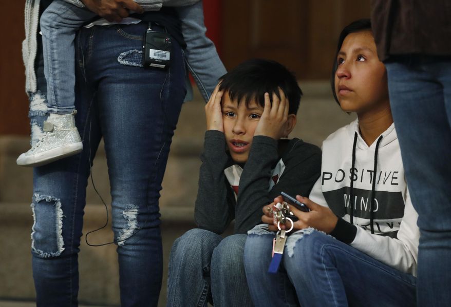 Roberto Vizguerra, center, and his sister, Luna, right, sit next to their mother, Jeanette, left, a Mexican woman seeking to avoid deportation from the United States, during a news conference in a church in which the Vizguerra and her children have taken refuge Wednesday, Feb. 15, 2017, in Denver. U.S. immigration authorities have her request to remain in the country. (AP Photo/David Zalubowski)