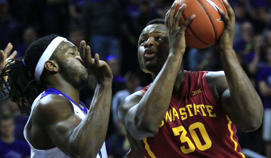 Iowa State guard Deonte Burton (30) drives on Kansas State forward D.J. Johnson (4) during the first half of an NCAA college basketball game in Manhattan, Kan., Wednesday, Feb. 15, 2017. (AP Photo/Orlin Wagner)
