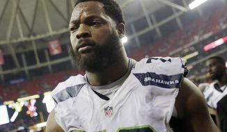 FILE - In this Jan. 14, 2017, file photo, Seattle Seahawks defensive end Michael Bennett (72) walks off the field after an NFL football divisional football game against the Atlanta Falcons, in Atlanta.  In an embarrassment to the Israeli government, only five of 11 NFL players have arrived on a sponsored trip aimed at improving the country&#39;s image. The ministry for strategic affairs and public diplomacy issued a press release after the Super Bowl boasting that the visit would bring &amp;quot;influencers&amp;quot; who would serve as &amp;quot;goodwill ambassadors&amp;quot; when they returned home. The announcement led Seahawks Michael Bennett to pull out. He accused the government of trying to use him for PR purposes and cited sympathy for the Palestinians. Several others players followed suit. (AP Photo/David Goldman, File)