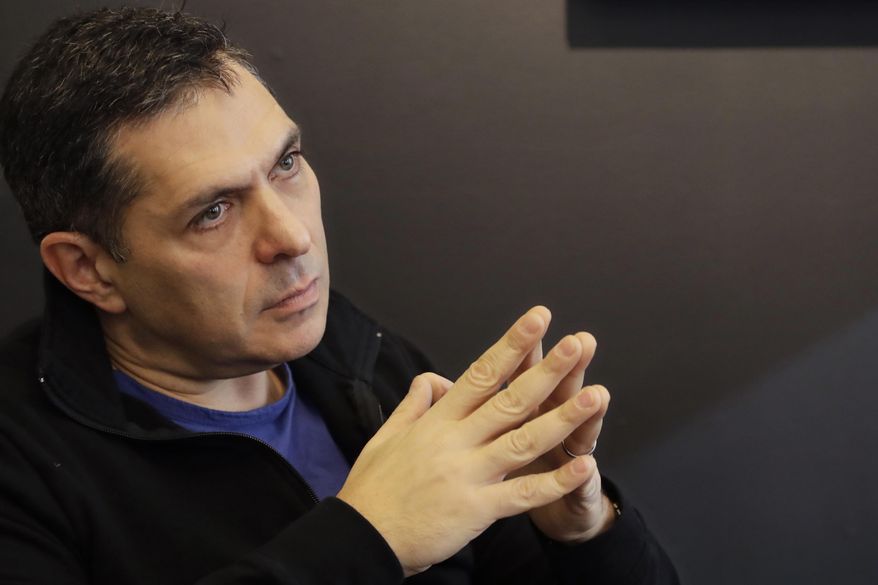 In this Monday, Feb. 6, 2017, photo, Kind CEO Daniel Lubetzky listens during an interview, in New York. Lubetzky is pledging $25 million over the next 10 years to create a nonprofit dedicated to “revealing and countering” the food industry’s influence on public health. The move underscores the division between “Big Food” companies and newer players that market themselves as wholesome alternatives aligned with public health. (AP Photo/Mark Lennihan)