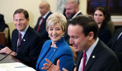 In this Jan. 24, 2017, file photo, Sen. Chris Murphy, D-Conn., right, introduces former wrestling entertainment executive Linda McMahon, center, at her confirmation hearing before the Senate Small Business and Entrepreneurship Committee on Capitol Hill in Washington. At left is Sen. Richard Blumenthal, D-Conn. The two senators she competed against in previous bitter campaigns and Democratic Gov. Dannel P. Malloy are complementing McMahon, the new administrator of the Small Business Administration, sworn in Tuesday, Feb. 14, 2017. (AP Photo/Alex Brandon, File)