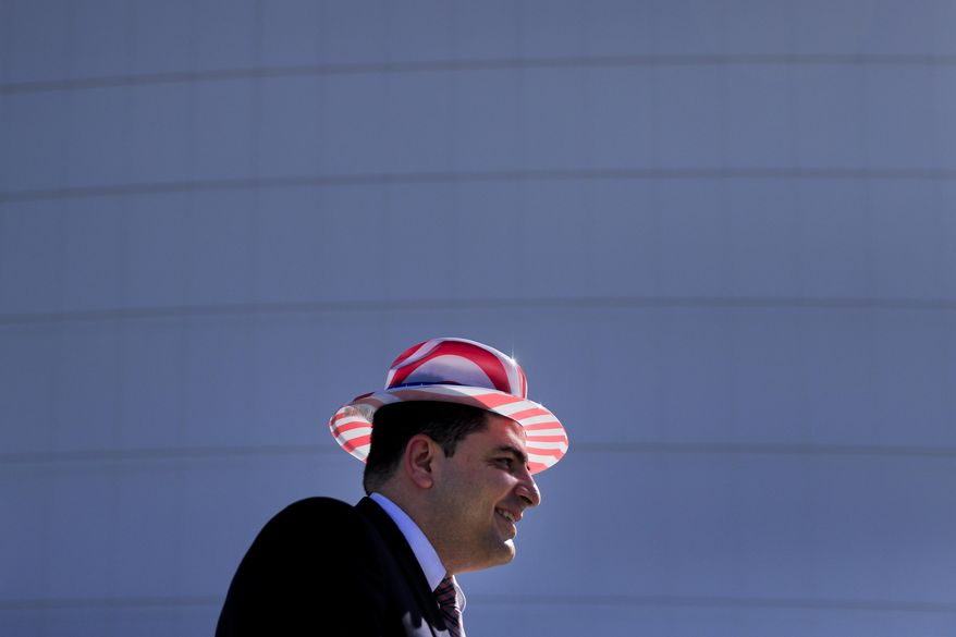 Sofian Haikal, a 36-year-old immigrant from Syria, pauses for photos after attending a naturalization ceremony to become a U.S. citizen, Wednesday, Feb. 15, 2017, in Los Angeles. About 3,000 people took the oath in the morning and more than 3,500 others were expected during an afternoon ceremony, according to U.S. Citizenship and Immigration Services officials. (AP Photo/Jae C. Hong)