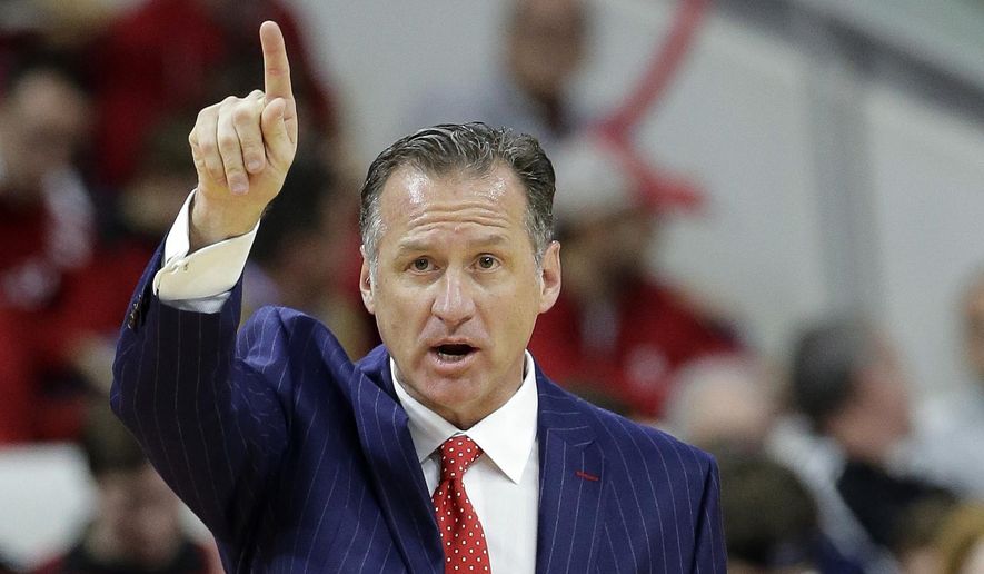 North Carolina State coach Mark Gottfried directs his team during the first half of an NCAA college basketball game in Raleigh, N.C., Wednesday, Feb. 15, 2017. North Carolina won 97-73. (AP Photo/Gerry Broome)